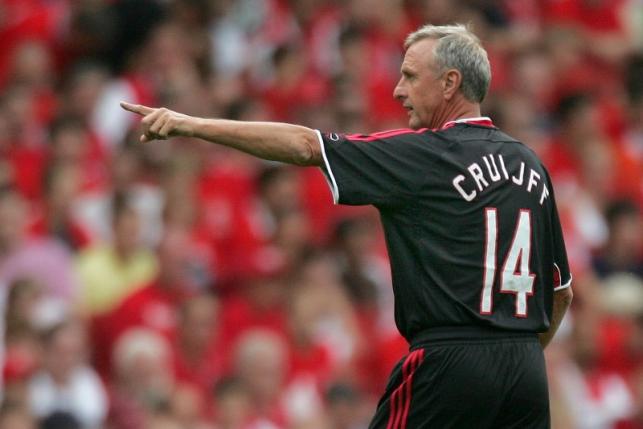 Dutch soccer legend Cruyff directs during a pre season friendly testimonial match playing for Ajax Legends against Arsenal in London