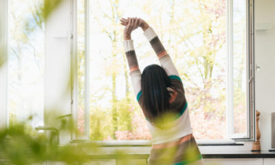 Woman stretching in kitchen