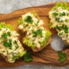 Egg salad sandwiches, on light background.