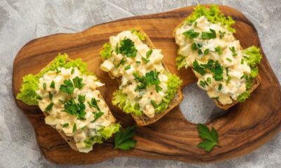 Egg salad sandwiches, on light background.