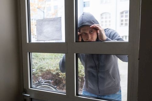 Thief Looking Through The Closed Door