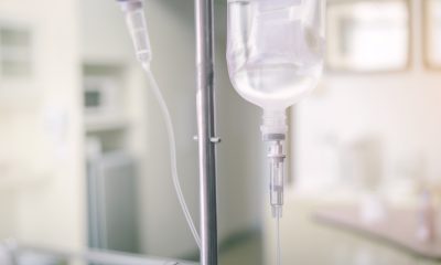 Close up IV saline solution drip for patient in hospital