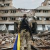 Ukrainian military woman with the Ukrainian flag in her hands on